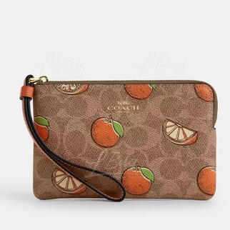 Coach Corner Zip Wristlet In Signature Canvas With Orange Print